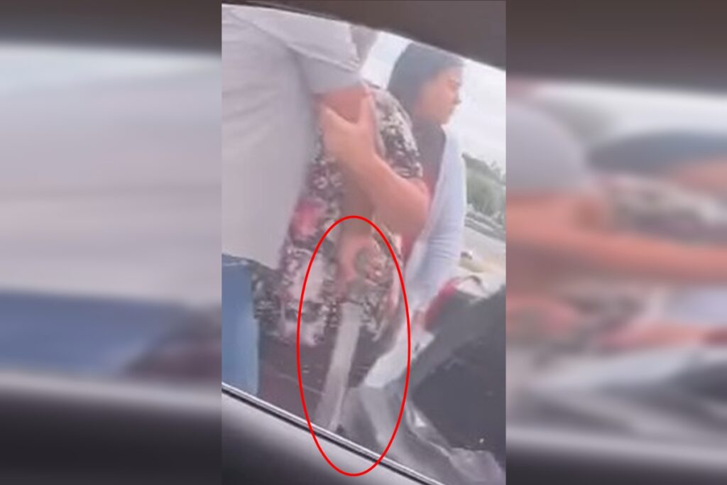 homem-e-contido-por-mulher-ao-pegar-facao-em-briga-de-transito.-video