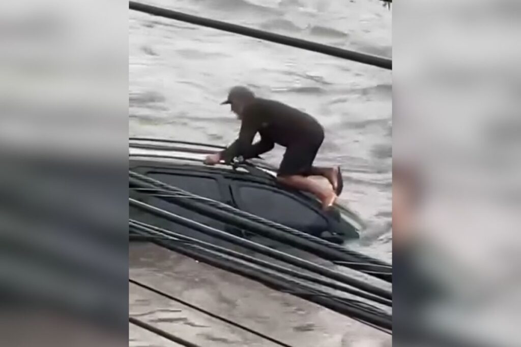 homem-fica-ilhado-em-teto-de-carro-apos-alagamento-em-sp.-video