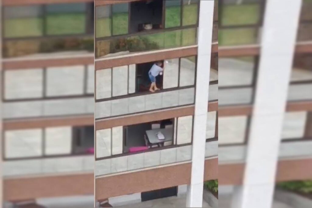 em-pe-na-janela:-mulher-arrisca-a-vida-ao-limpar-vidro-em-aguas-claras