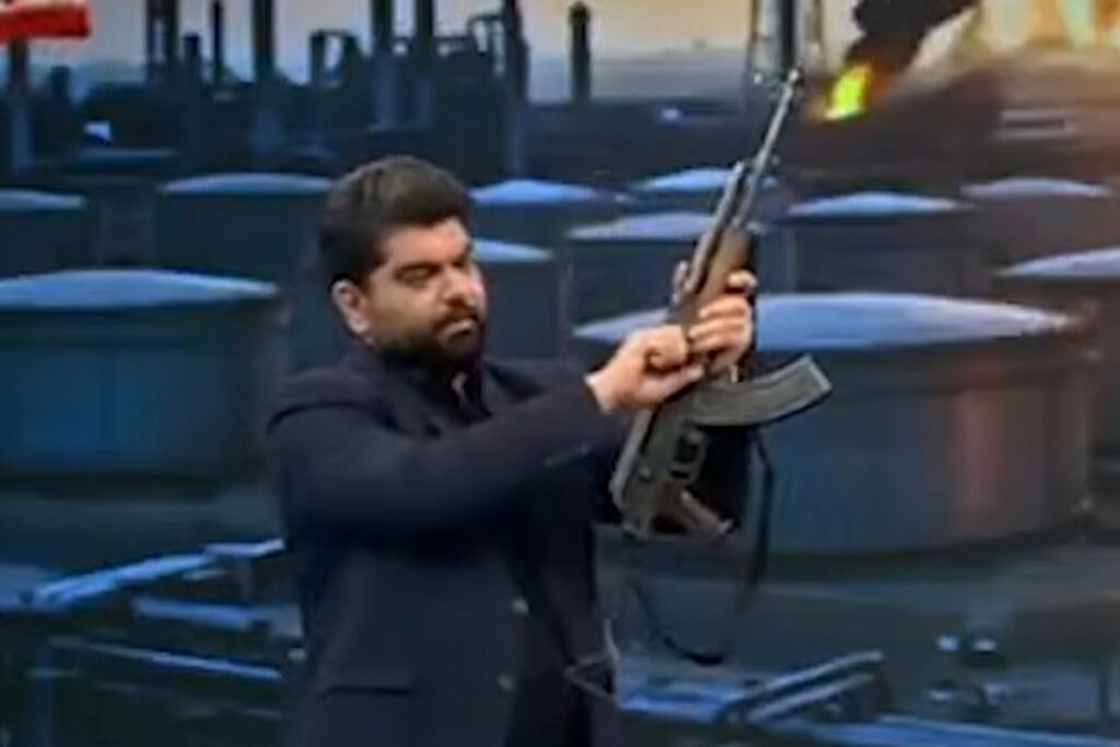 apresentador-de-tv-dispara-fuzil-durante-transmissao-ao-vivo-no-ira.-veja-video
