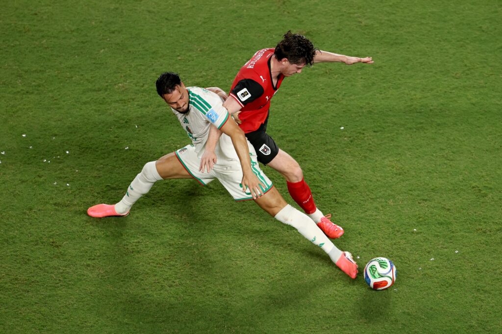 com-emocao,-argelia-e-austria-empatam-e-vao-ao-mata-mata-da-copa