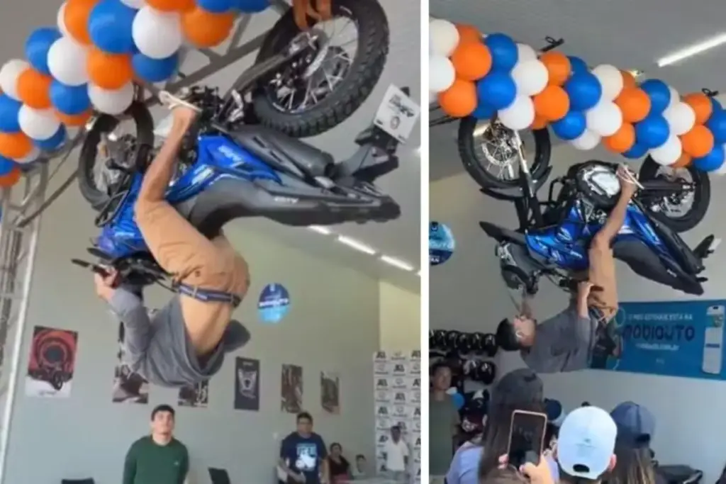 Concessionária promete moto 0 km para quem ficar 10 minutos de cabeça para baixo pendurado no veículo, atrai mais de 20 participantes, ninguém consegue completar o desafio e vídeo ultrapassa 10 milhões de visualizações enquanto ação levanta dúvidas sobre segurança
