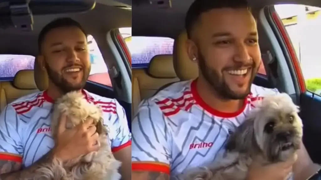 Motorista de aplicativo inicia a primeira corrida do dia em São Gonçalo, reconhece no meio da rua o cachorro da tia desaparecido havia três dias, pede desculpas à passageira para parar o carro e recupera o animal enquanto a mulher se oferece para levá-lo no colo